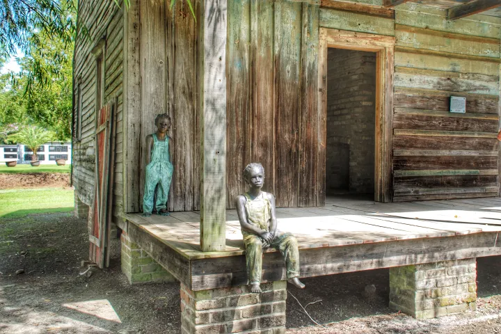 a wooden bench sitting next to a door