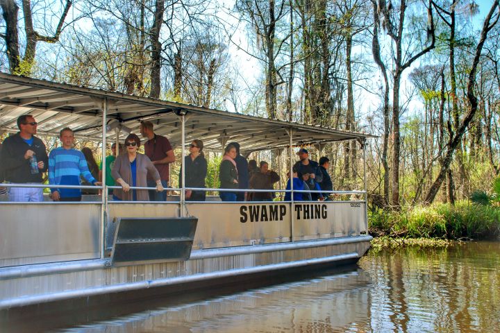 a group of people riding on the back of a boat