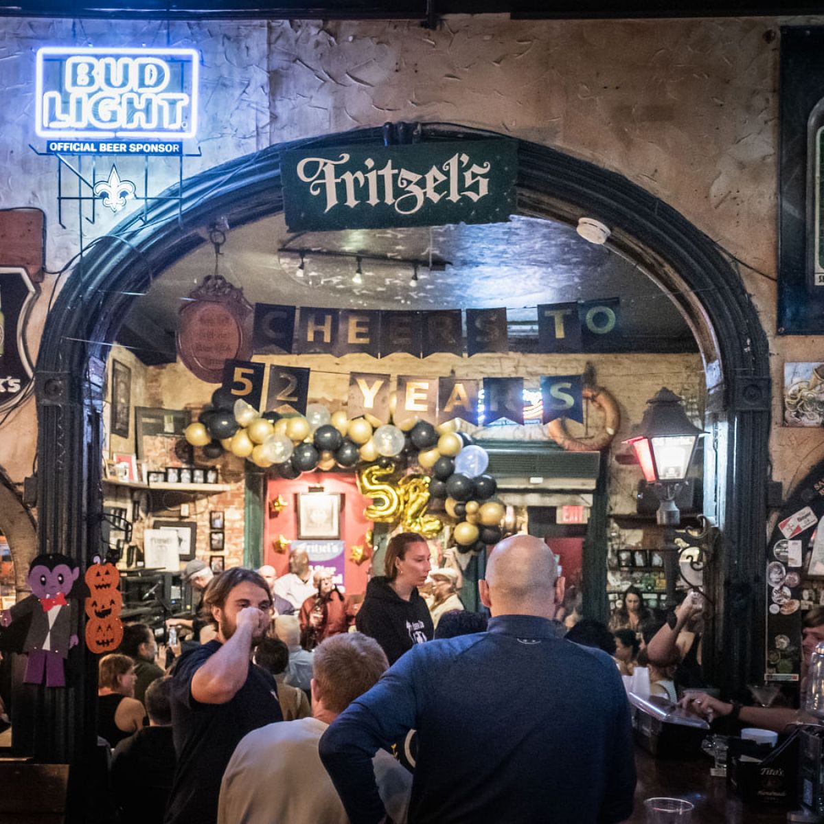 a group of people standing in front of a store