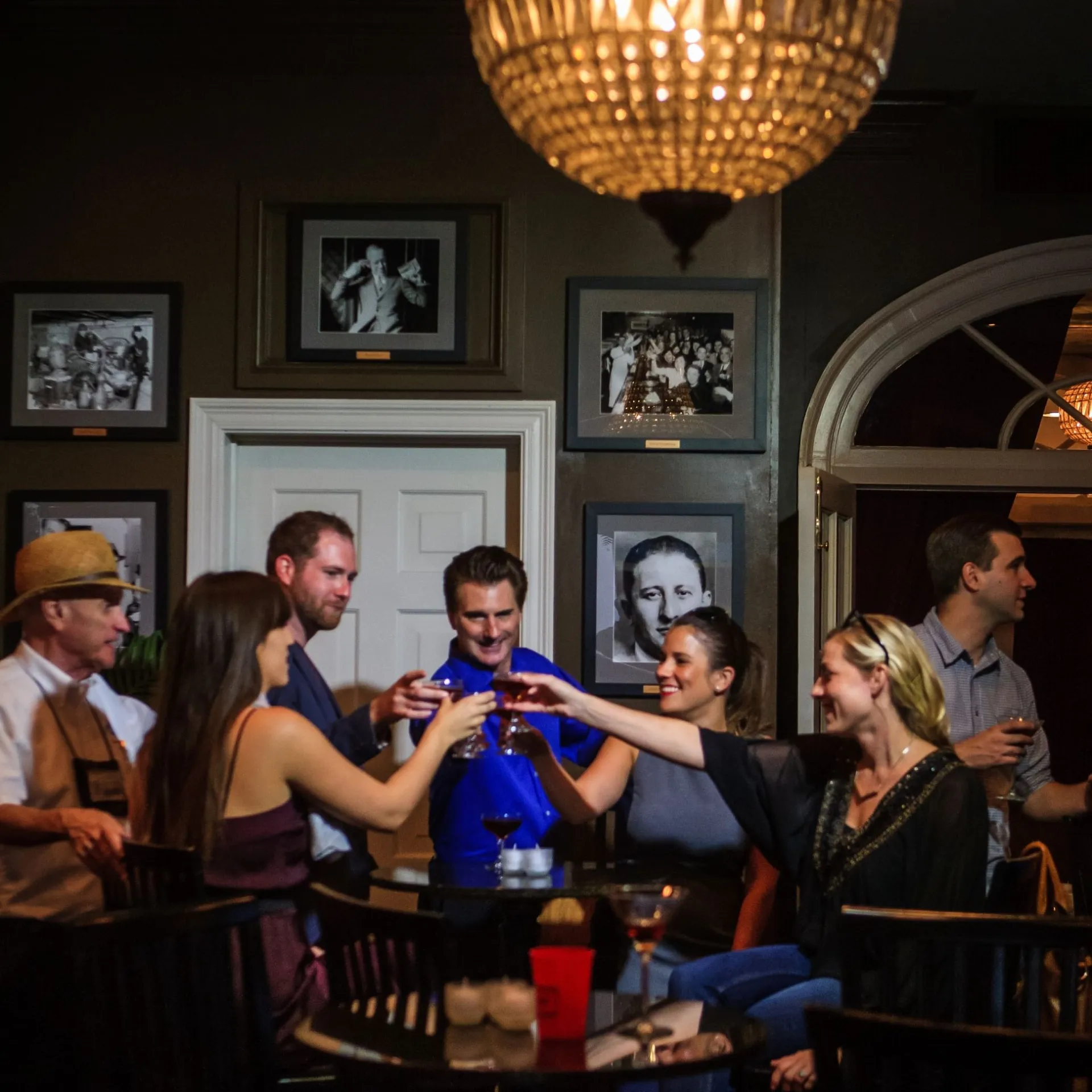 Carlo Gambino et al. standing in a room