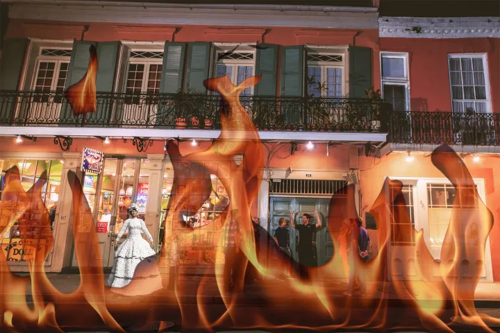 Building facade with people, overlay of flames in foreground.